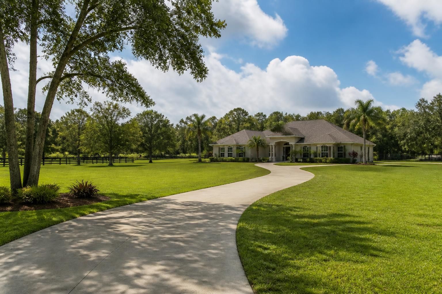 Spacious residential landscape with large lots and greenery.
